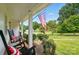 Cozy front porch with rocking chairs, patriotic pillows, and a view of the well-manicured lawn at 2968 Grace St, Claremont, NC 28610