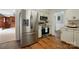 Updated kitchen featuring stainless steel appliances and hardwood floors at 2968 Grace St, Claremont, NC 28610