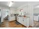 Bright kitchen featuring white cabinets, stainless steel appliances, and modern fixtures at 2968 Grace St, Claremont, NC 28610