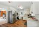 Spacious kitchen with stainless steel appliances, granite countertops, and white cabinetry at 2968 Grace St, Claremont, NC 28610
