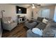 Cozy living room with ample seating, wood-look flooring, and neutral decor at 2968 Grace St, Claremont, NC 28610