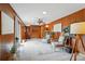 Cozy living room featuring wood paneling, natural light, and comfortable seating at 2968 Grace St, Claremont, NC 28610