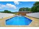 Backyard pool is surrounded by a white fence, creating a private oasis at 2968 Grace St, Claremont, NC 28610