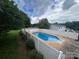 Backyard featuring an in-ground pool with a well-maintained fence and lush greenery at 2968 Grace St, Claremont, NC 28610