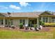 A well-maintained backyard with a patio, lush lawn, and mature landscaping at 31415 Royal Tern Ln, Fort Mill, SC 29707