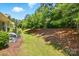 Expansive backyard with mature trees and lush greenery, perfect for outdoor enjoyment at 31415 Royal Tern Ln, Fort Mill, SC 29707