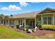 Spacious backyard featuring a patio, lush lawn, and mature trees at 31415 Royal Tern Ln, Fort Mill, SC 29707