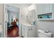 Bathroom with sink and vanity, cabinet storage, and view into the bedroom at 31415 Royal Tern Ln, Fort Mill, SC 29707