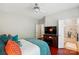 Bedroom with hardwood floors, en suite bathroom, and television at 31415 Royal Tern Ln, Fort Mill, SC 29707