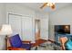 Cozy bedroom featuring a closet, television, and wood floors, creating a comfortable retreat at 31415 Royal Tern Ln, Fort Mill, SC 29707