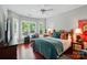Bright bedroom featuring large windows, hardwood floors and ample natural light at 31415 Royal Tern Ln, Fort Mill, SC 29707