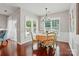 Dining room with wood floors, plantation shutters, and modern light fixture at 31415 Royal Tern Ln, Fort Mill, SC 29707