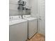 Functional laundry room with modern appliances, ample storage, and a convenient layout at 31415 Royal Tern Ln, Fort Mill, SC 29707