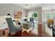 Cozy living room with hardwood floors, white sofa, stylish decor, and bright natural light at 31415 Royal Tern Ln, Fort Mill, SC 29707
