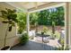 Charming patio with lush plants and seating, perfect for outdoor relaxation at 31415 Royal Tern Ln, Fort Mill, SC 29707