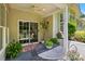 Comfortable outdoor patio featuring a ceiling fan, sliding glass doors, and lovely greenery at 31415 Royal Tern Ln, Fort Mill, SC 29707