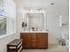 Bathroom featuring double vanity with wood cabinets and stylish mirrors at 3306 Yarmouth Ln, Gastonia, NC 28056