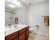 Well-lit bathroom with a single sink vanity, mirror, and a shower and tub combination at 3306 Yarmouth Ln, Gastonia, NC 28056
