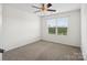Neutral bedroom featuring a window, neutral walls, neutral carpet, and overhead lighting at 3306 Yarmouth Ln, Gastonia, NC 28056