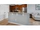 Kitchen featuring a breakfast bar, wood cabinets, granite countertops, and stainless steel appliances at 3306 Yarmouth Ln, Gastonia, NC 28056