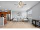 Bright and spacious living room with wood floors, a gray sectional couch, and large windows at 3306 Yarmouth Ln, Gastonia, NC 28056