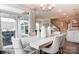 Dining room area with table and seating for six, sliding doors, and chandelier at 3315 Whispering Creek Dr # 95, Wesley Chapel, NC 28079