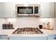 Close-up of kitchen counter showcasing stainless steel gas range, decorative backsplash and modern design at 3315 Whispering Creek Dr # 95, Wesley Chapel, NC 28079