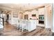 Modern kitchen with white cabinets, stainless steel appliances, island, and pendant lighting at 3315 Whispering Creek Dr # 95, Wesley Chapel, NC 28079