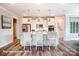 Bright kitchen featuring an island with bar seating, stainless appliances, and stylish pendant lights at 3315 Whispering Creek Dr # 95, Wesley Chapel, NC 28079