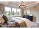 Inviting main bedroom with a large window, dresser, and carpeted floors at 3315 Whispering Creek Dr # 95, Wesley Chapel, NC 28079