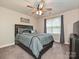 Cozy bedroom featuring a ceiling fan, window, carpet, and neutral wall paint at 3409 Valdosta Ct, Monroe, NC 28110
