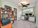 Bright bedroom or office featuring a built-in desk, bookshelf, and ample space at 3409 Valdosta Ct, Monroe, NC 28110