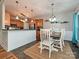 Inviting dining area featuring modern pendant lighting and convenient access to the kitchen at 3409 Valdosta Ct, Monroe, NC 28110