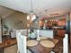 Features a wood dining table with seating for six, and views to the kitchen and living room at 3409 Valdosta Ct, Monroe, NC 28110