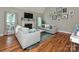 Features hardwood floors, a fireplace, and two sofas with throw pillows at 3409 Valdosta Ct, Monroe, NC 28110