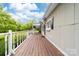 Expansive porch with white railings offers a lovely outdoor living space at 3716 Hamilton Dr, Gastonia, NC 28052