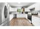 Bright kitchen featuring white cabinets, stainless steel appliances, and granite countertops at 3716 Hamilton Dr, Gastonia, NC 28052