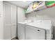 Laundry room with washer, dryer, storage shelves and bi-fold door at 3716 Hamilton Dr, Gastonia, NC 28052