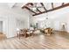 Spacious living area with dining, wooden beams, modern furniture, and lots of natural light at 3716 Hamilton Dr, Gastonia, NC 28052