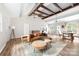 Bright and airy living room boasts vaulted ceilings and exposed wooden beams at 3716 Hamilton Dr, Gastonia, NC 28052