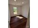 A clean and bright bedroom is filled with natural light and features luxury hardwood floors at 401 Constant Ln, Charlotte, NC 28722