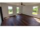 Bedroom featuring three windows with stunning views at 401 Constant Ln, Charlotte, NC 28722