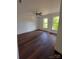 Bedroom featuring bright windows and hardwood floors at 401 Constant Ln, Charlotte, NC 28722