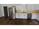 Kitchen area features a stainless steel refrigerator and stainless steel appliances at 401 Constant Ln, Charlotte, NC 28722