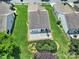 Aerial view of a home with a large lawn, patio, and manicured bushes at 4044 Murray St, Indian Land, SC 29707