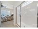 Bright bathroom showcasing glass shower with a view into the bedroom at 4044 Murray St, Indian Land, SC 29707