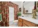 Bathroom with floral-patterned shower curtain and framed pictures at 4044 Murray St, Indian Land, SC 29707