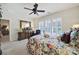 Bright bedroom with shuttered windows, floral bedding, and elegant dresser providing a cozy retreat at 4044 Murray St, Indian Land, SC 29707