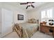 Cozy bedroom featuring a decorative metal bed frame and a window at 4044 Murray St, Indian Land, SC 29707