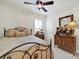 Bedroom features a ceiling fan, window, and vintage wood dresser at 4044 Murray St, Indian Land, SC 29707